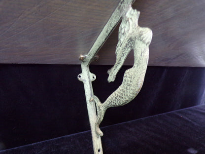 Artisan-Crafted Shelf with Mermaid Brackets