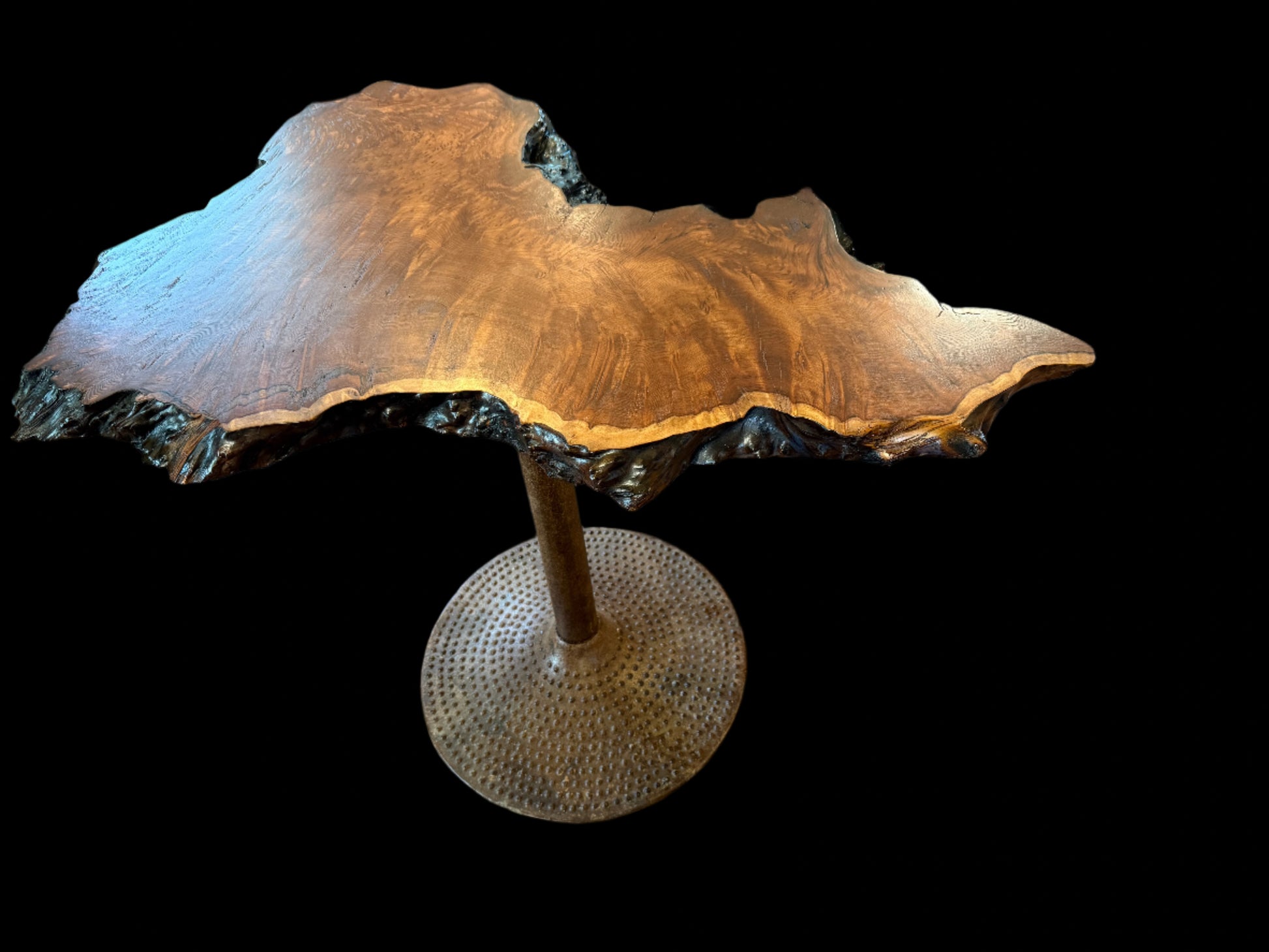 Wooden table with a unique design on a wooden floor