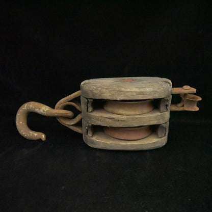 Antique 18-inch double sheave wooden block pulley.