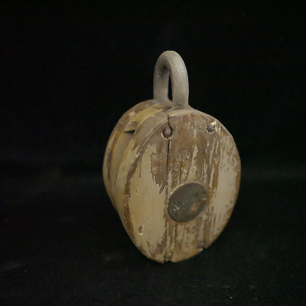 Antique 6-inch single sheave wooden block pulley.