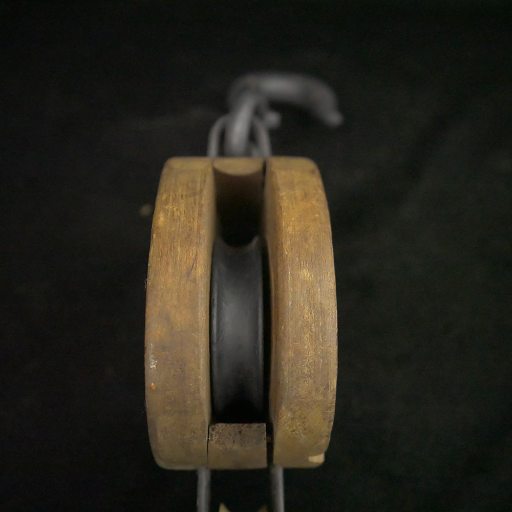 Antique 12.75-inch single sheave wooden block pulley.