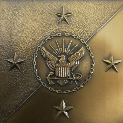 Closeup of emblem US Navy bronze square plaque.