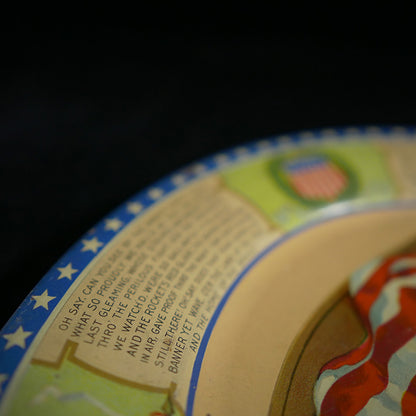 Closeup of first stanza of Star Spangled Banner on plate