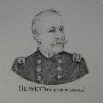 Closeup of "Dewey 'The Hero of Manilla'" etching on plate.