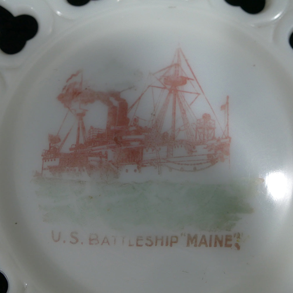 Closeup of decorative commemorative plate honoring the U.S. Battleship Maine