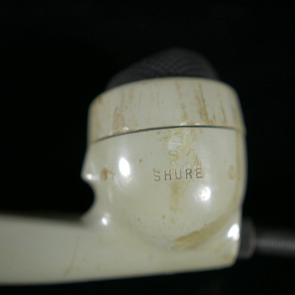 Closeup of handset showing "Shure"