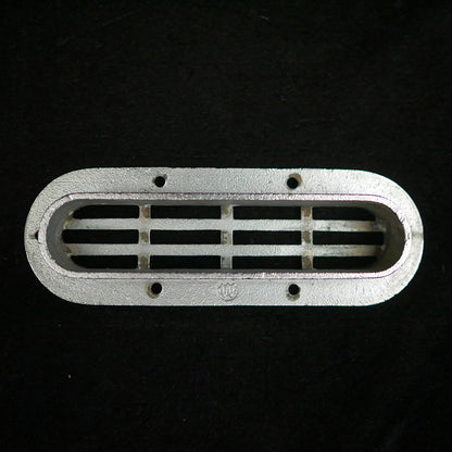 Vintage oval flush stainless steel drain cover.