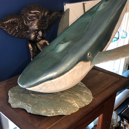 Sounding Blue Whale, Wood Carving on Rock